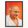 Mahatma Gandhi Orange Background Portrait Photo Frame 21 Mahatma Gandhi clear smiling Gandhi portrait on a orange background photo frame – Black Frame