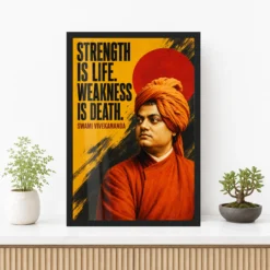Swami Vivekananda Strength Is Life Quote Photo Frame showing a bold mustard-and-black screen poster with the Strength Is Life quote – Premium Console Lifestyle View